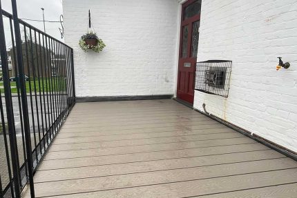 Carefully crafted outside staircase combining durable metal framework with sleek, modern composite decking.