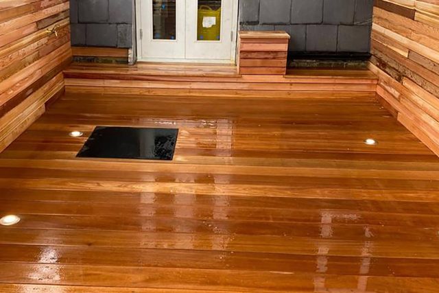 Roof Terrace Design Chiswick The combination of the cedar roof terrace decking, double French wooden doors, and spotlights on kitchen floor.