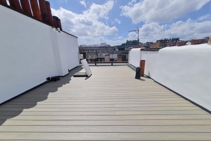 Newly converted modern roof terrace in Westminster, featuring sleek metal railings and stylish composite decking.