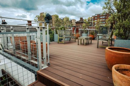 Lush rooftop garden setting on a converted London flat roof, designed for cultivating plants and embracing a sustainable lifestyle.