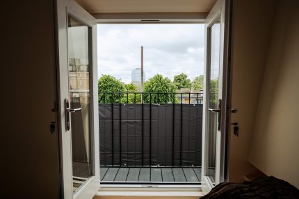 Stylish and highly durable composite decking installed over a Sika Sarnafil flat roof system on a London terrace.