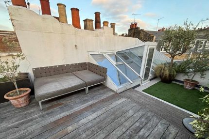 Complete structural transformation of a dilapidated flat roof into a secure, value-adding outdoor living space in Surrey.