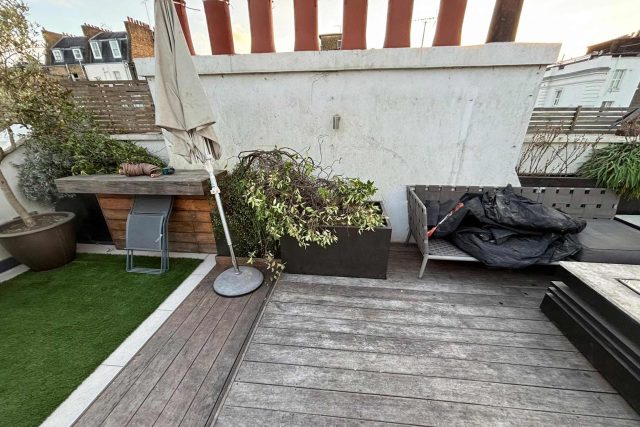 Premium structural decking installed by our expert roofer London team to seamlessly integrate with artificial turf.