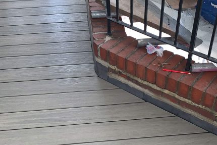 High-quality, cost-effective composite decking installed on a residential roof terrace as an alternative to traditional wood.