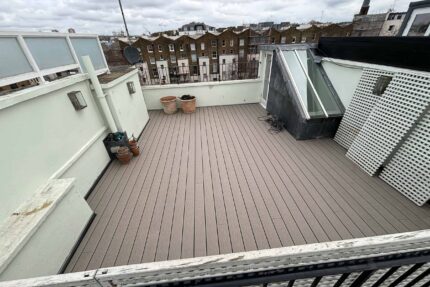 Construction phase showing the treated plywood deck and 120mm PIR insulation to improve thermal performance on a London roof.