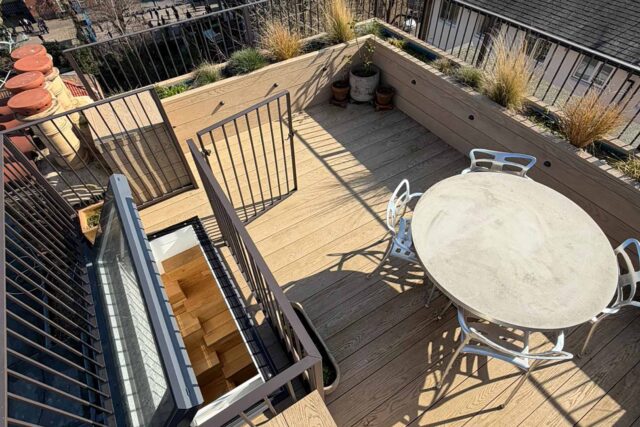 Commercial access hatch and robust composite decking forming the structural foundation of an exclusive flat roofing London hospitality venue.