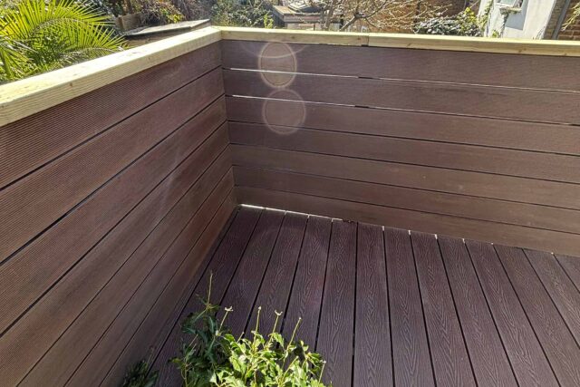 Flat Roof Terrace renovation company refurbished decking, felt roof replacement roofer near me latest in Richmond Surrey, sleek functional.