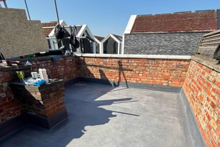 Advanced waterproofing membrane and precise perimeter coping stones installed by our expert roofer London contractors.