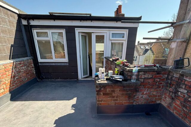 Robust SIKAPLAN flat roof waterproofing membrane applied meticulously to protect a premium residential terrace upgrade.