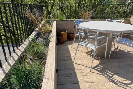 Heavy-duty concrete table and structural decking featured in a B2B hospitality venue by our leading flat roofing London contractors.