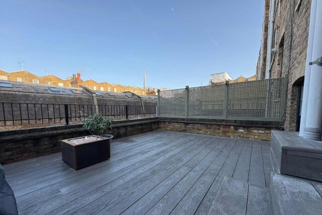 Premium Millboard composite decking and a bespoke timber trellis form the foundation of this high-end flat roofing London installation, transforming a residential Maida Vale property into a luxurious al-fresco living space.