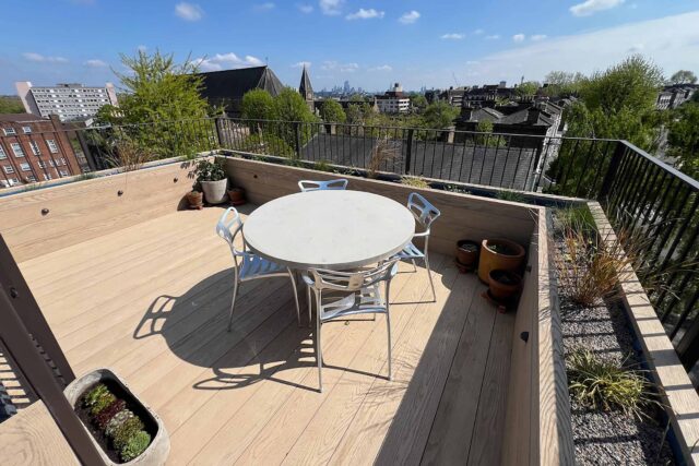 Premium residential flat roof conversion featuring a durable Millboard dining terrace installed by our expert flat roofer team in London.