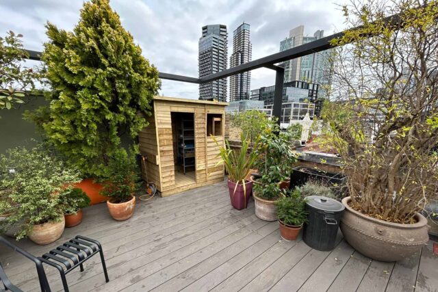 Elegant zero-rot decking and a custom pergola complete this structural residential roof garden conversion by our London roofing experts in Shoreditch.