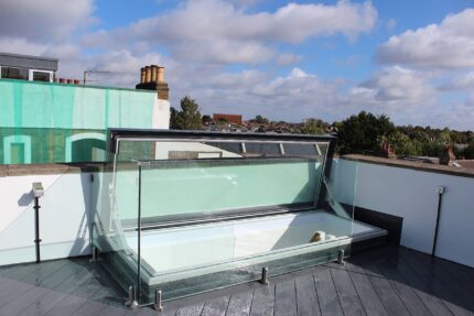 Installation of custom-engineered steel beams and roof joists for a Barnes roof conversion.