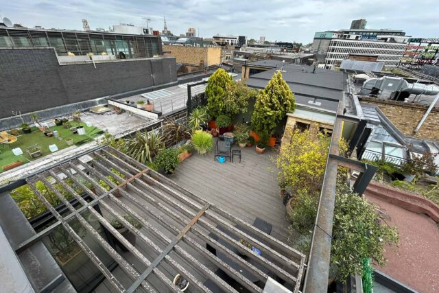 Eco-friendly timber decking being laid for a luxury rooftop garden by our highly skilled roofer London installation team.