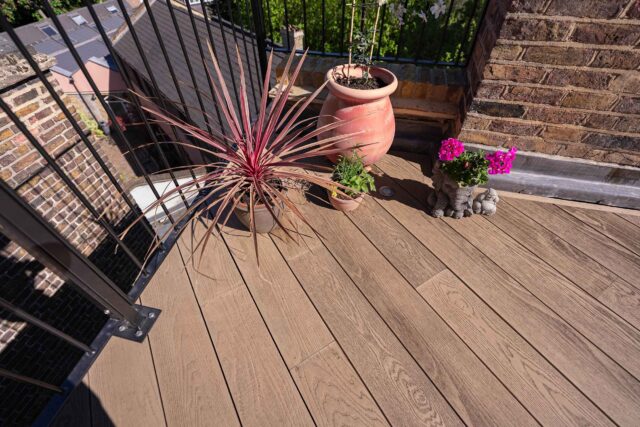 Bespoke architectural planters featuring vibrant seasonal greenery in London.