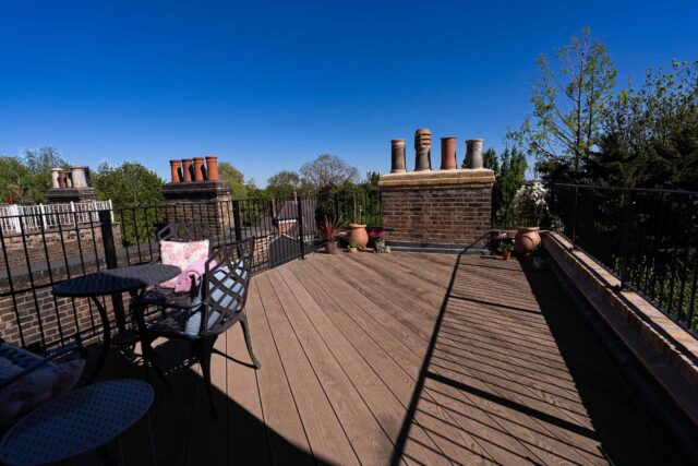 An intimate evening seating arrangement on a modern Belsize Park roof garden.