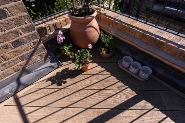 Sleek minimalist perimeter planters installed on a Belsize Park roof garden.